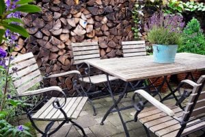 backyard eating area with table and chairs.